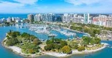 Aerial view of Sarasota, Florida waterfront communities and marinas, representing the type of HOA and condo associations efficiently managed with ManageCasa.